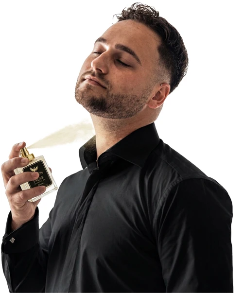 Man holding luxury perfume bottle for Maison Falak in elegant setting